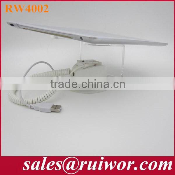 Tablets security warning exhibit holder in Interactive experience stores used in cabinet