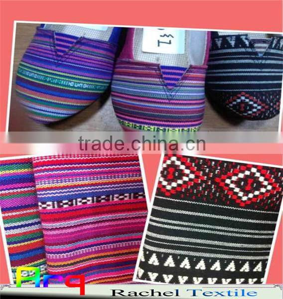 Multi colored fabric with many bright color, stripe design using for home textile or garments