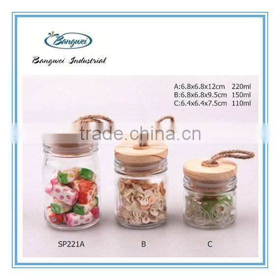 glass spice jar with wooden lid and spoon