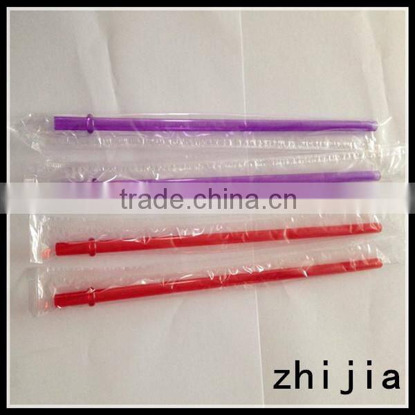 Clear wrapped red plastic drinking straw