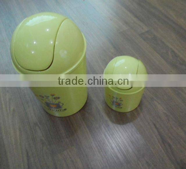 Round swing-top plastic trash can