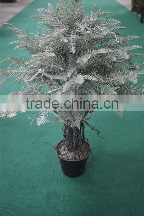 Holy and pure artificial Christmas tree in pot