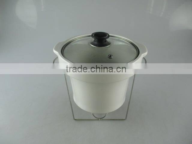 Stocked ceramic tureen with glass lid and iron stand