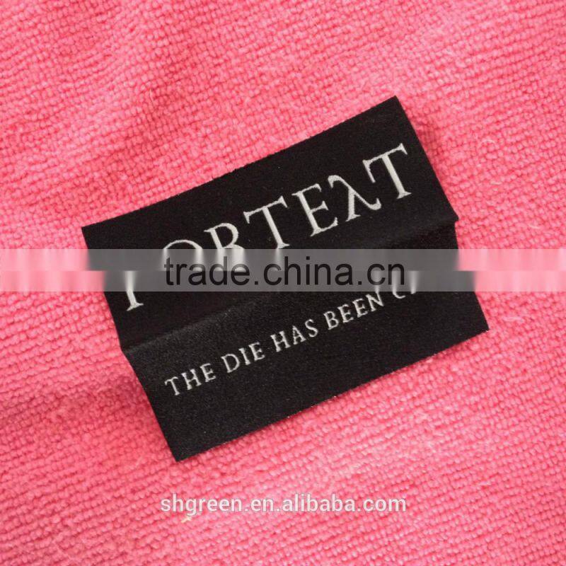 Wood spindle satin weaving label