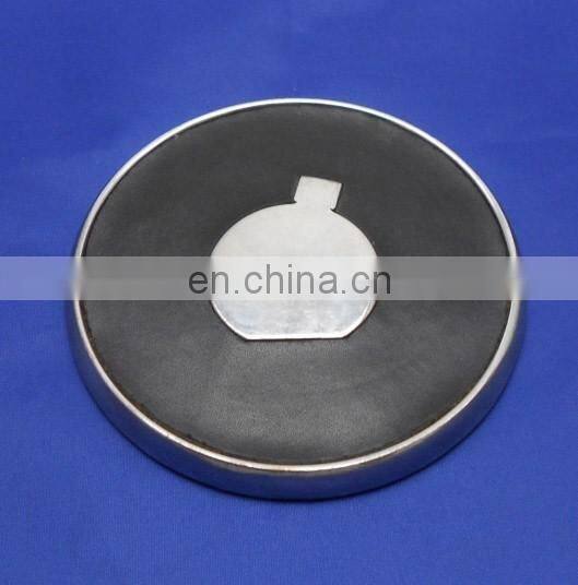 two metal coasters packed in a wood base