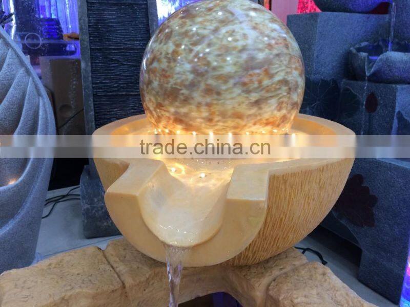LED yellow light color resin and sandstone fountain with ball