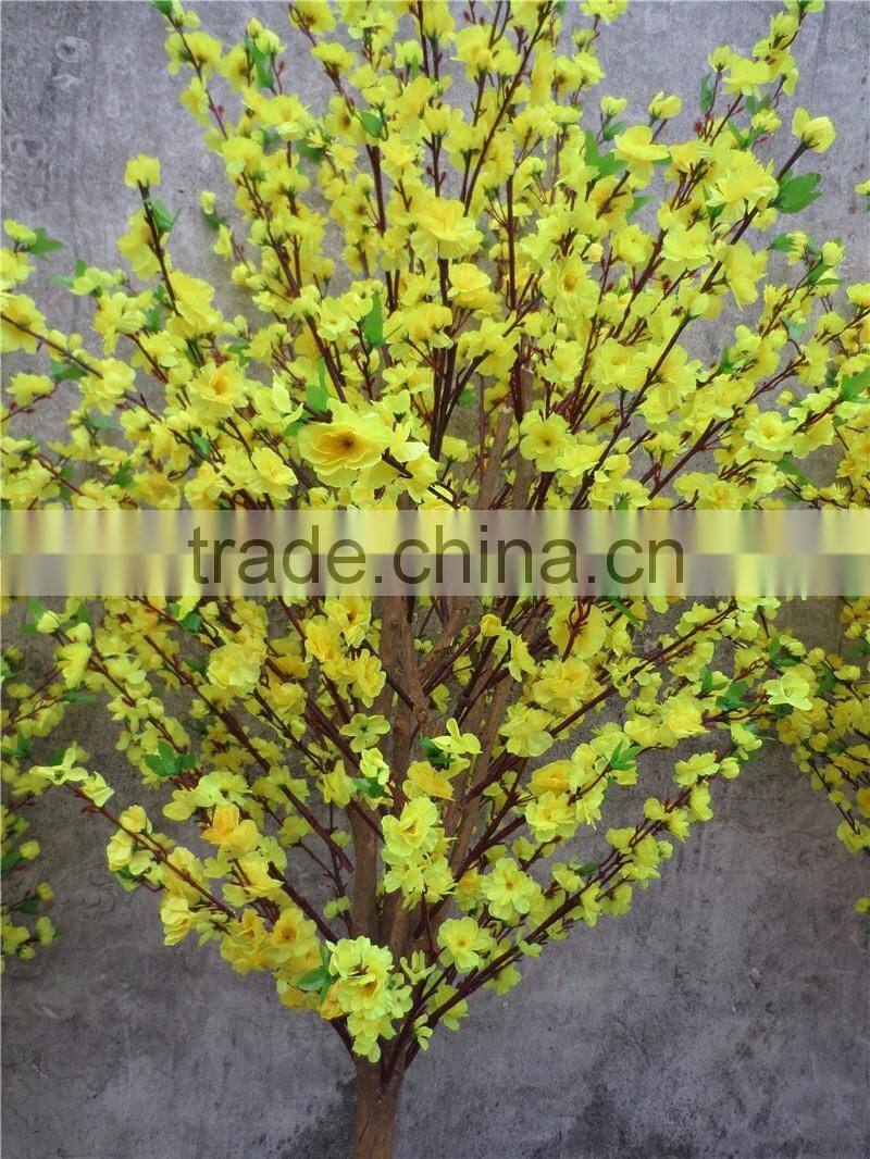 Yellow silk cherry blossom tree with artificial flower