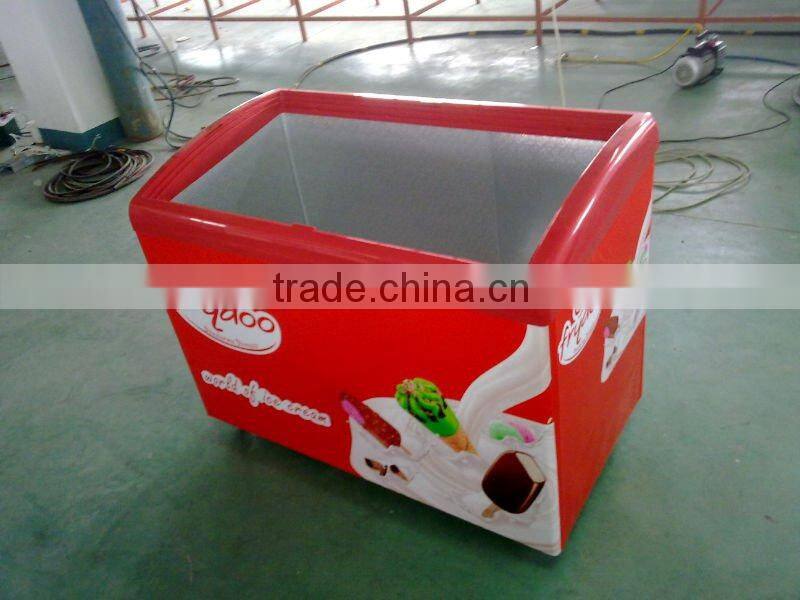 Curved glass door freezer with light box