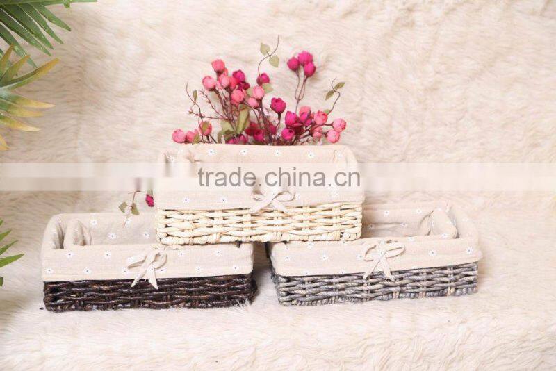 set of 2 maize weaved remote storage baskets