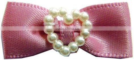 ribbon bows with a heart-shaped bead necklace