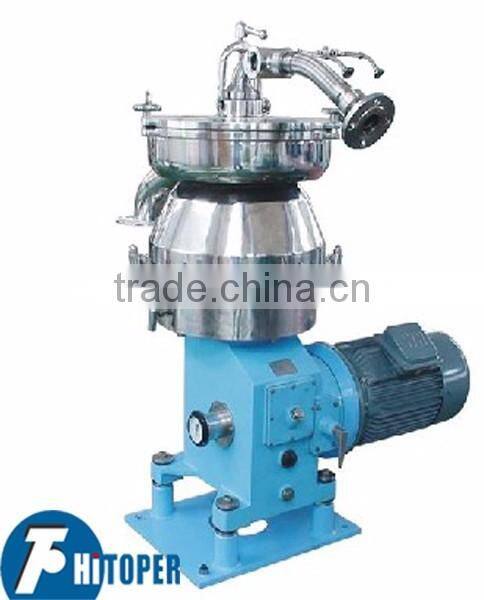 Automatic discharge centrifugal separation of milk