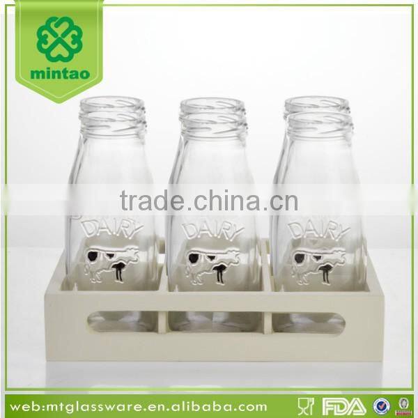 display box packing small glass bottles with lids and paper straw