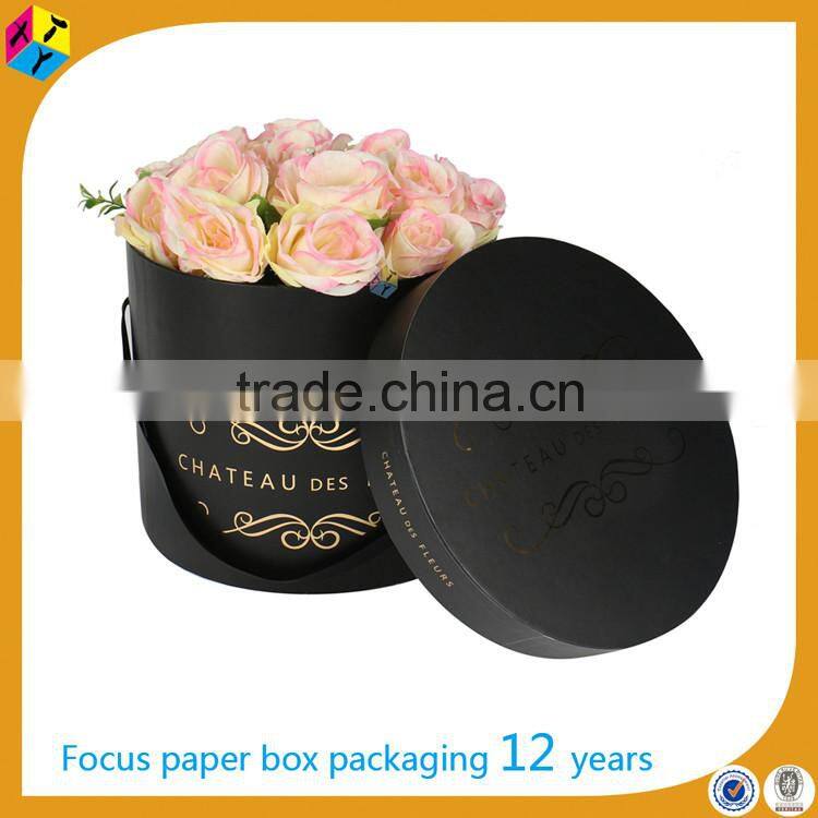 decorative cardboard with ribbon flowers in hat box