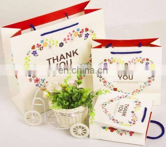 2015 cost production cookies packing paper bag with hanlde for shopping