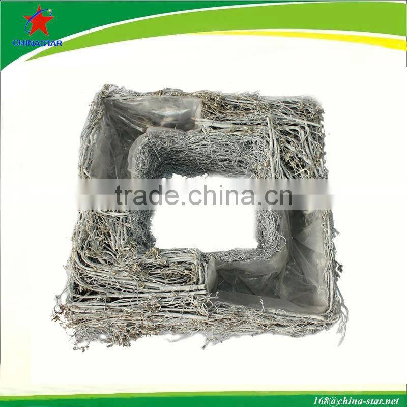 square snowy wicker wreath with flower pot