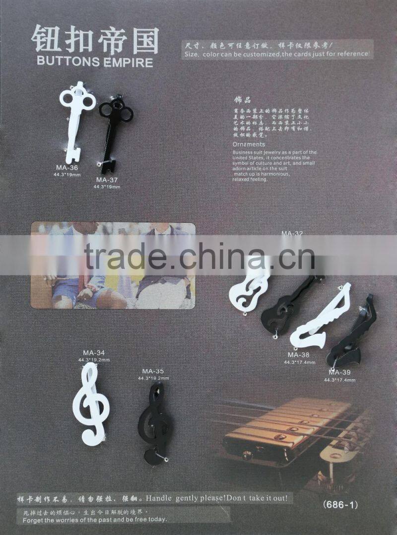 matt black key-shaped metal brooch for men