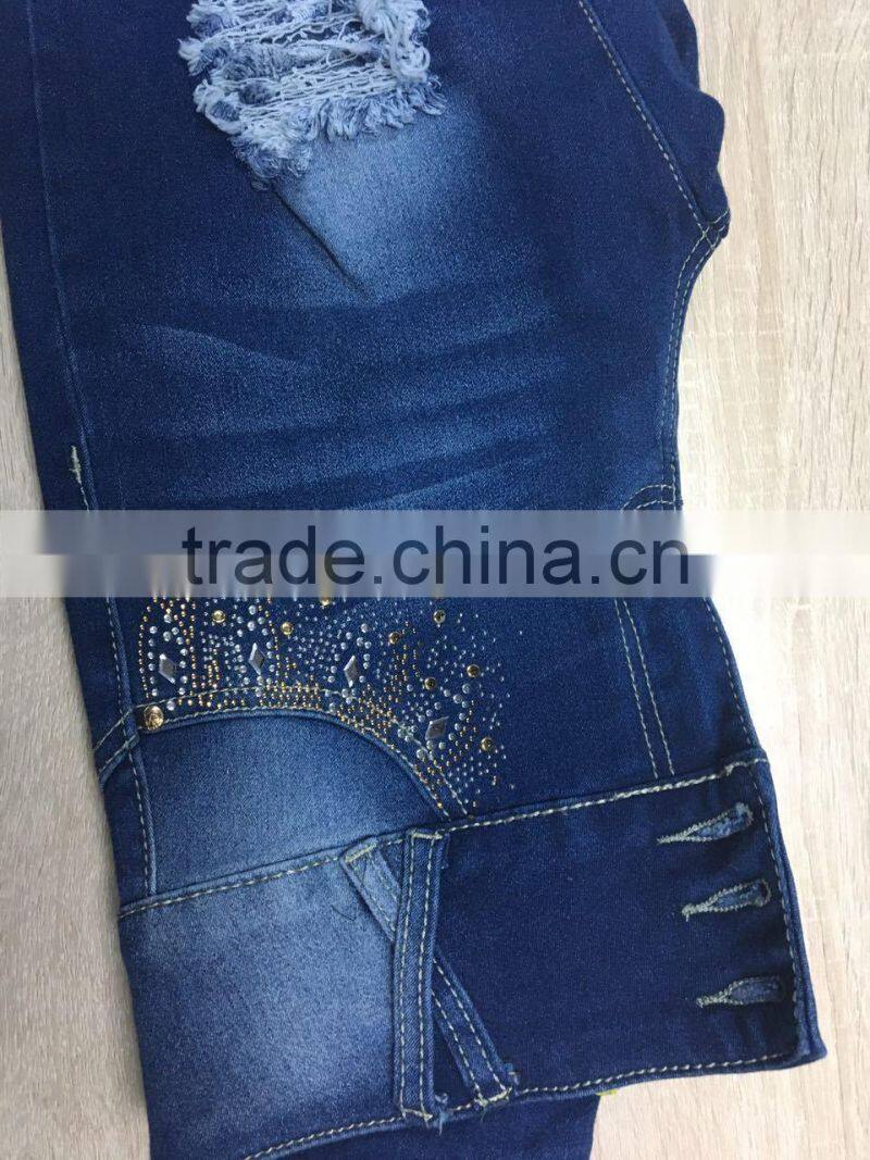 GZY slim and ripped hole women jeans leather label stock high quality wholesale china 2017