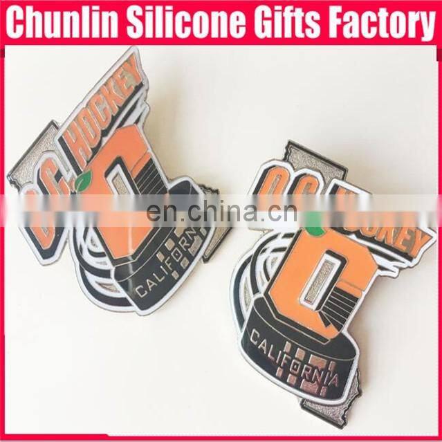 carved lapel pin with resin