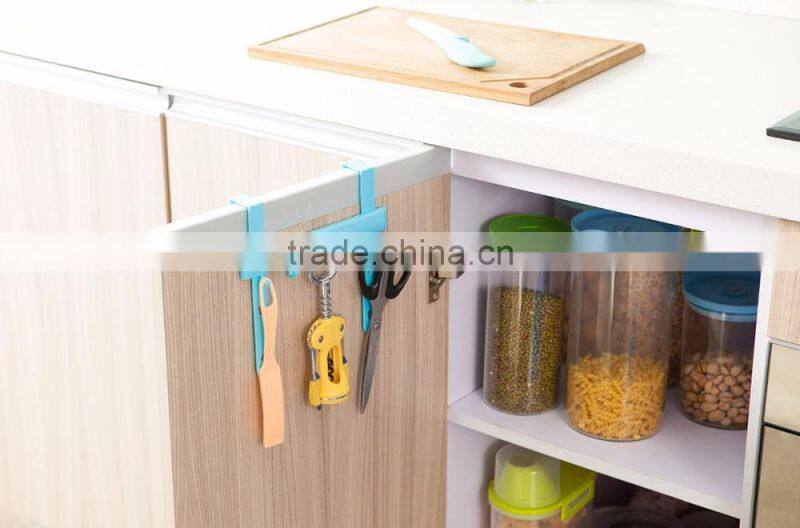 Multipurposed pothook behind the kitchen door