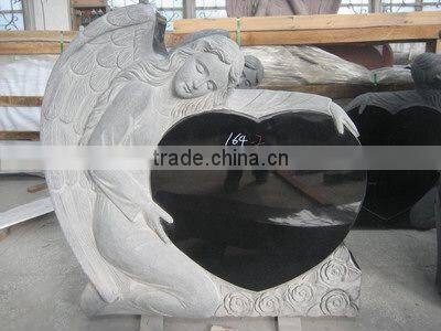 Granite tombstone with angel carving