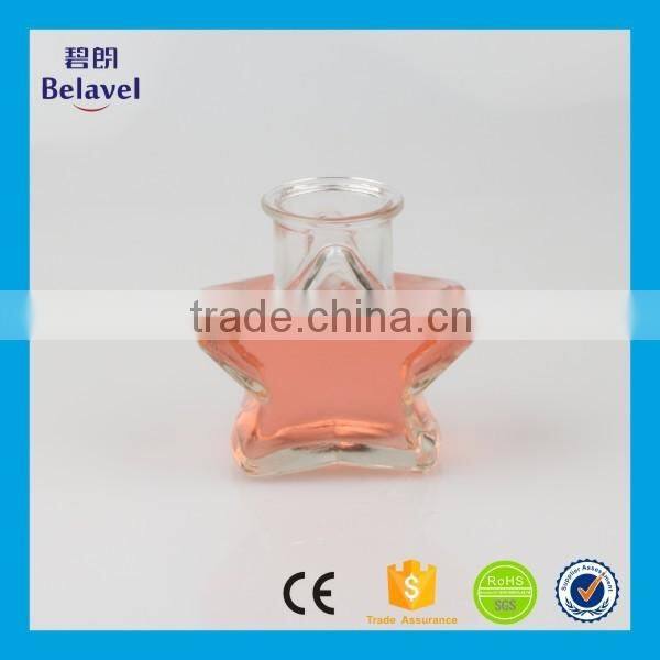 Hot sale star shape wedding decoration clear glass mini bottle