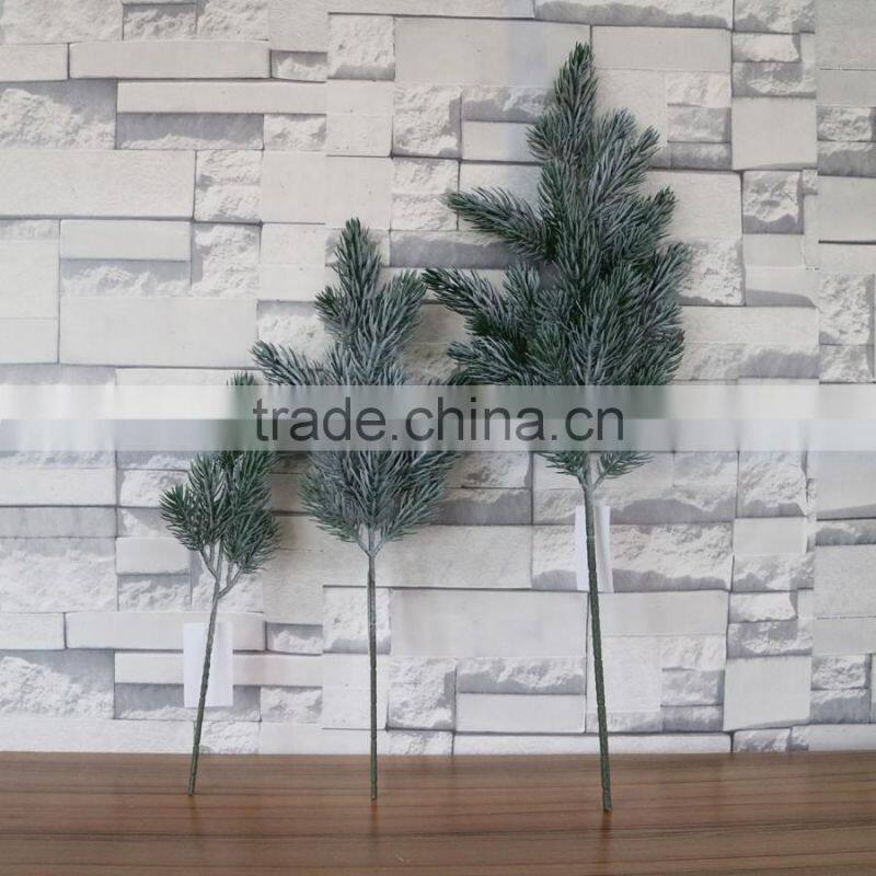 Plastic white pine tree branch flocked