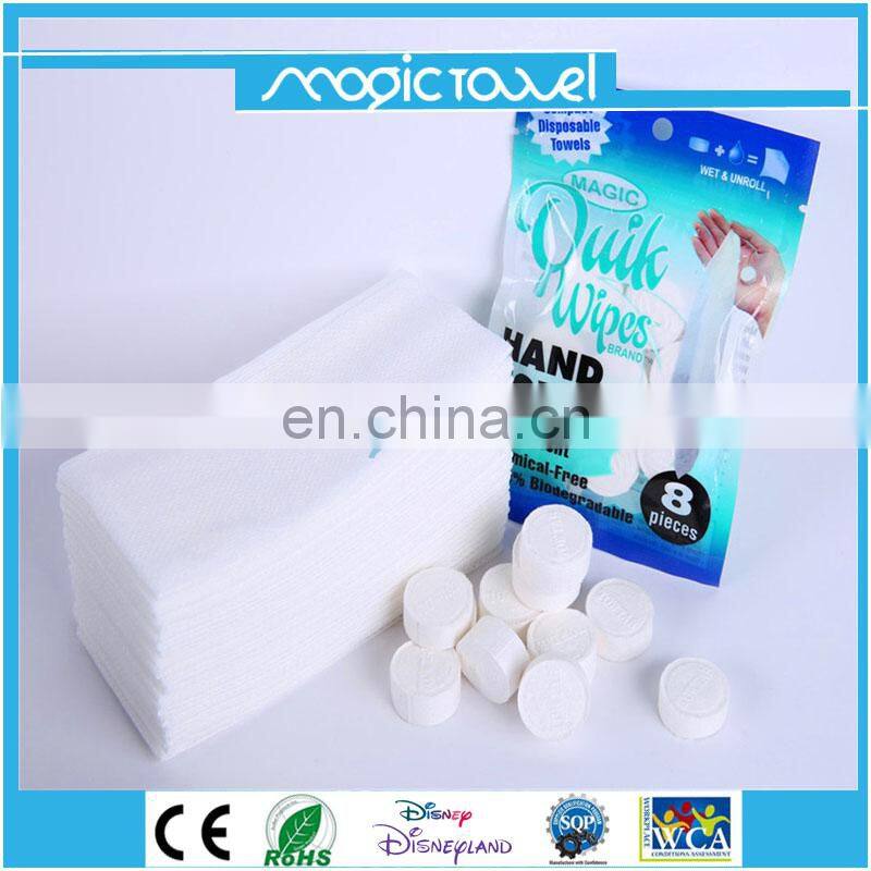 Eco friendly100% rayon material OEM compressed tissue/magic coin hotel napkins/paper roll compressed tablet wipe