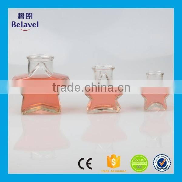 Hot sale star shape wedding decoration clear glass mini bottle