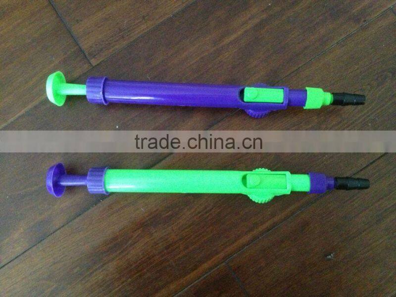 Plastic water balloon pump filler with Pepsi Cola bottle