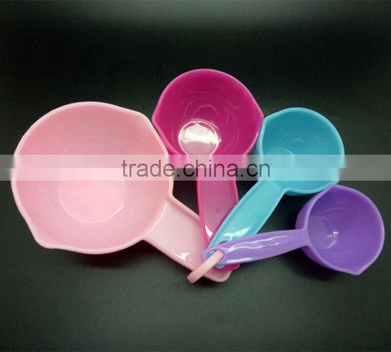 colorful set of 4 plastic measuring cups and spoons