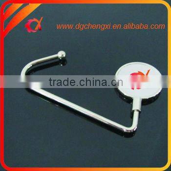 China hot sale round shape bag hanger with CX logo and metal hook