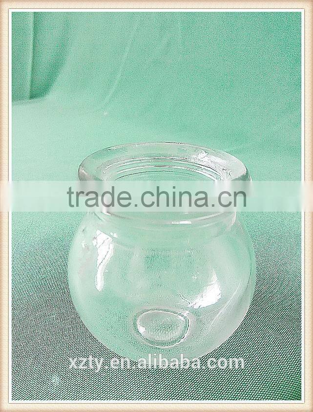 tall round glass pudding bottle for cadlestick or ashtray