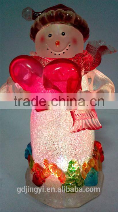 Holding a red heart acrylic snowman with LED Light