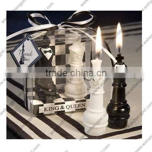 Wedding candles on the chess king and queen