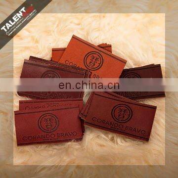 high quality customized private brand name logo jeans genuine leather patch in garment