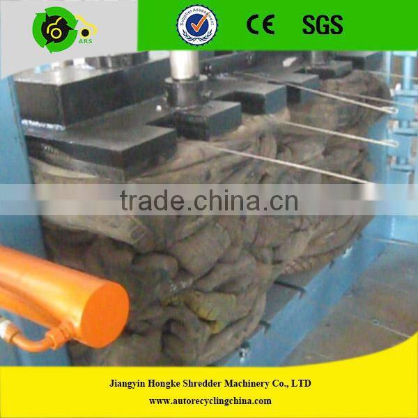 Automatic hydraulic baler for scrap tires