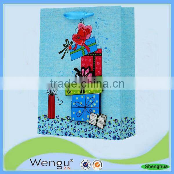 fancy present paper bag in unique design with pp ribbon handle made in china supplier and manufacture