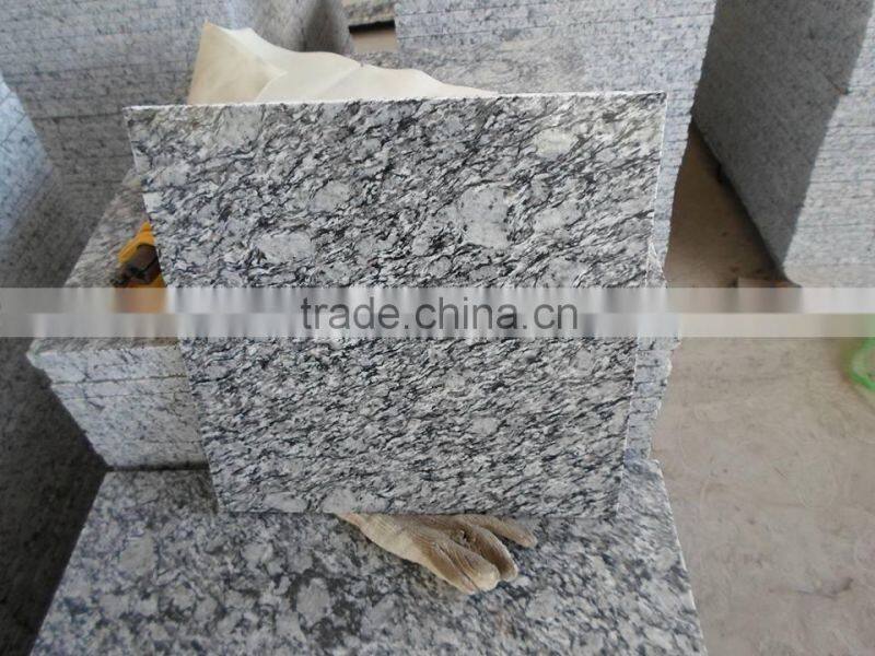 China spray white granite tile prices