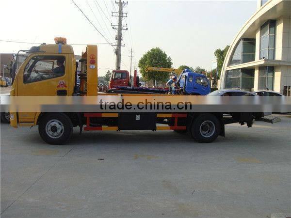 small flatbed towing truck