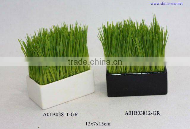 artificial grass in white ceramic pot