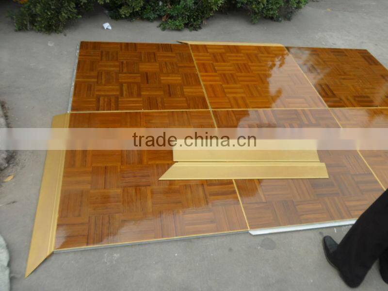 Natural teak wooden dance floor with gold anodized aluminum trim