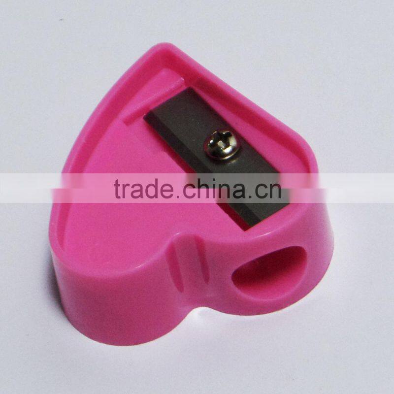 One hole plastic novelty heart shaped pencil sharpener