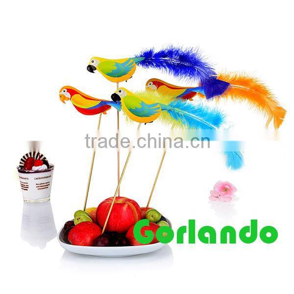 Parrot colorful decoration cake and fruit wooden cocktail picks in bar