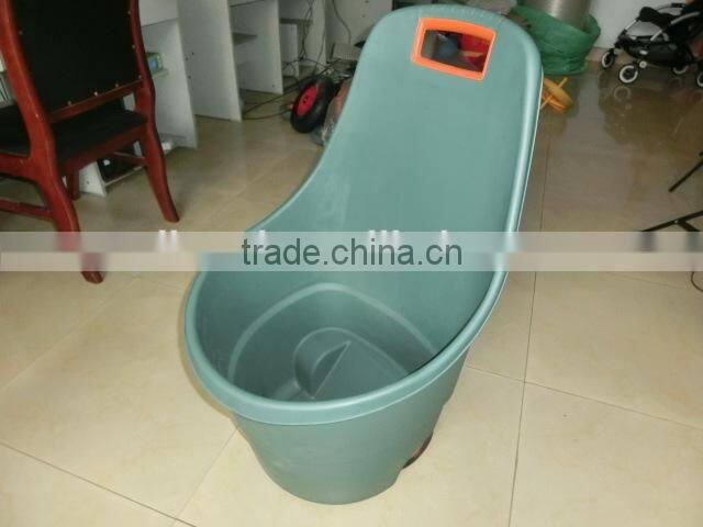 plastic trolley bin in garden , garden tool trolley