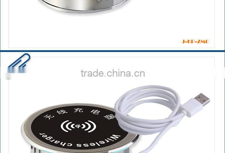 New smartphone Qi desktop wireless charger embedded on the furniture table