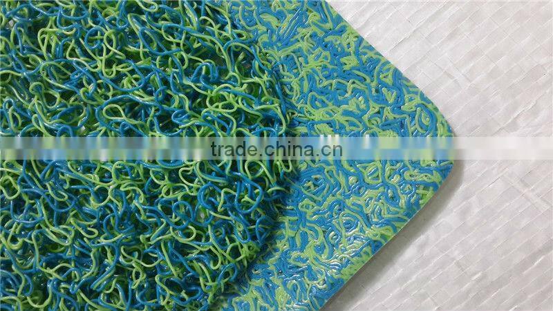 Green plastic door mat