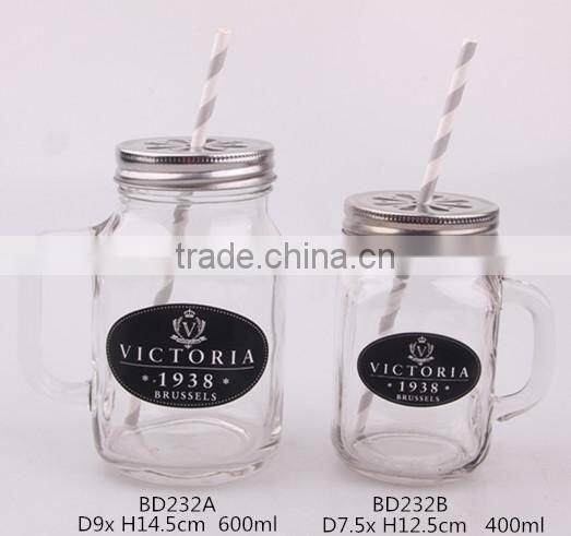 glass mason jar with metal lid and paper straw