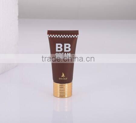 labeling collapsible empty tube with champagne aluminium cap