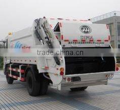 Sweep blade compression garbage truck