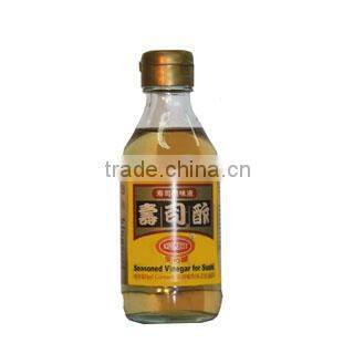 Seasoned sushi vinegar in glass bottle